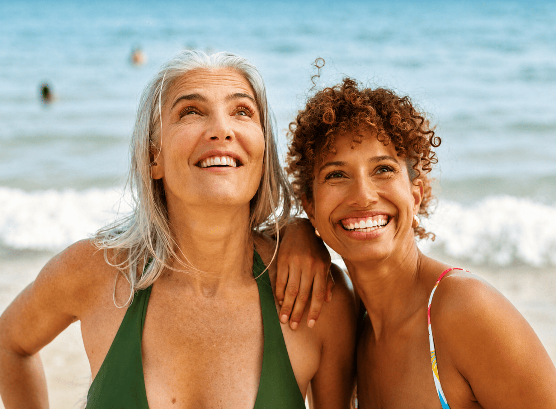 Two women in the summer time, happy.